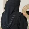 Elegant Black Abaya in a Modern Setting